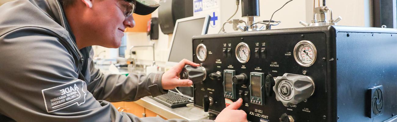 Student adjusting dials on a Twin Cell UCA